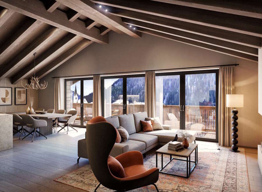 This stunning penthouse boasts a spacious open-plan living area with vaulted ceilings and exposed wooden beams, creating a warm and inviting atmosphere.