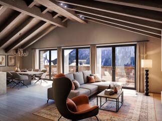 This stunning penthouse boasts a spacious open-plan living area with vaulted ceilings and exposed wooden beams, creating a warm and inviting atmosphere.