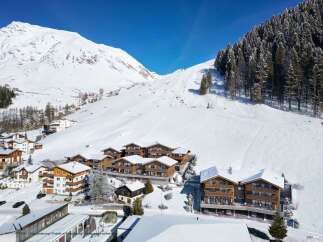 Nestled in a stunning alpine setting, this luxurious chalet development offers breathtaking mountain views and ski-in/ski-out access.