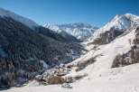 Nestled in a snow-covered valley, this charming village offers breathtaking views of the majestic Alps.