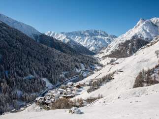 Nestled in a snow-covered valley, this charming village offers breathtaking views of the majestic Alps.