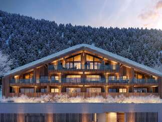 Luxury chalet nestled in a snowy mountainside, offering breathtaking views.