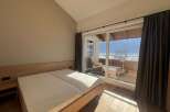Enjoy breathtaking mountain views from this cozy bedroom.