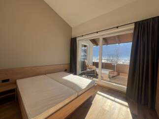 Enjoy breathtaking mountain views from this cozy bedroom.