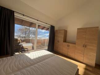 Enjoy breathtaking mountain views from this stunning bedroom.