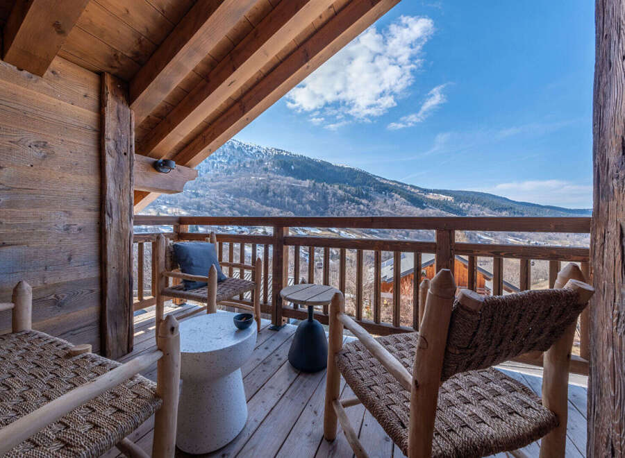 Enjoy breathtaking mountain views from this charming balcony.