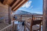Enjoy breathtaking mountain views from this charming balcony.