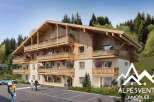 Discover this stunning chalet-style apartment building nestled in a picturesque mountain setting.