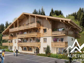 Discover this stunning chalet-style apartment building nestled in a picturesque mountain setting.