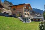 Discover your dream chalet in the heart of the Alps! This stunning property boasts a modern design with wooden accents, offering a warm and inviting atmosphere.