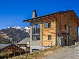 Discover this stunning modern chalet nestled in the heart of the Alps, offering breathtaking mountain views.