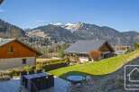 Discover your dream alpine retreat! This stunning property boasts breathtaking mountain views and a serene, natural setting.