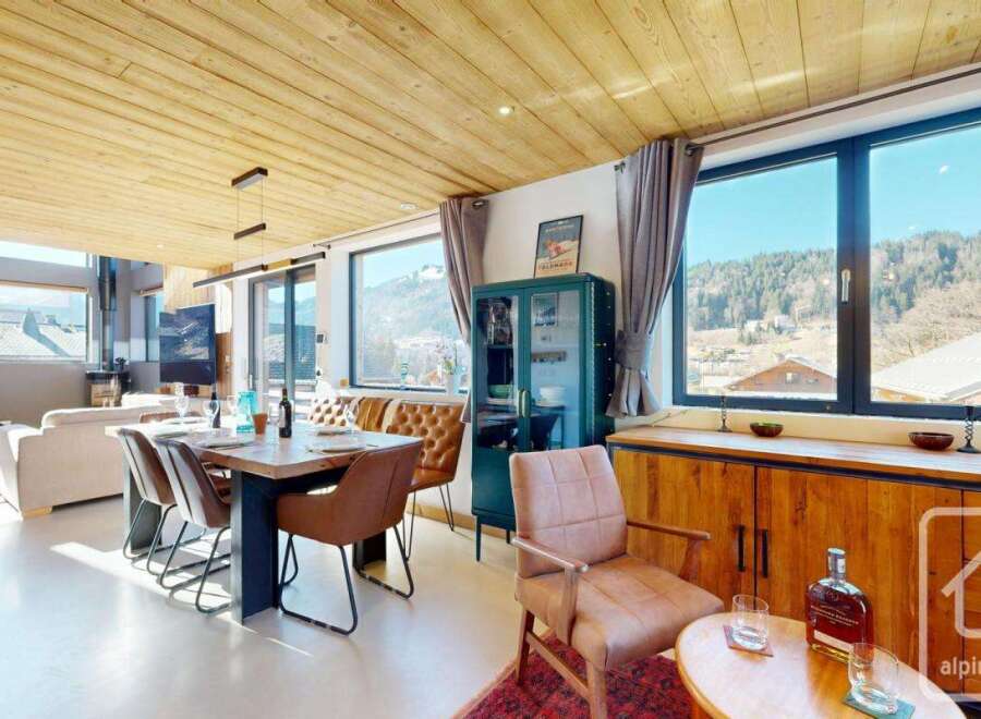 Experience luxury living in this stunning property, featuring a spacious dining area with a modern design.