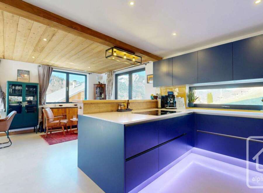 Discover modern living in this stunning kitchen! Featuring sleek blue cabinetry, a stylish island, and a bright, open layout, this space is perfect for both cooking and entertaining.
