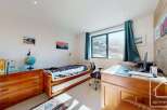 Discover the charm of this inviting bedroom, perfect for relaxation and productivity.