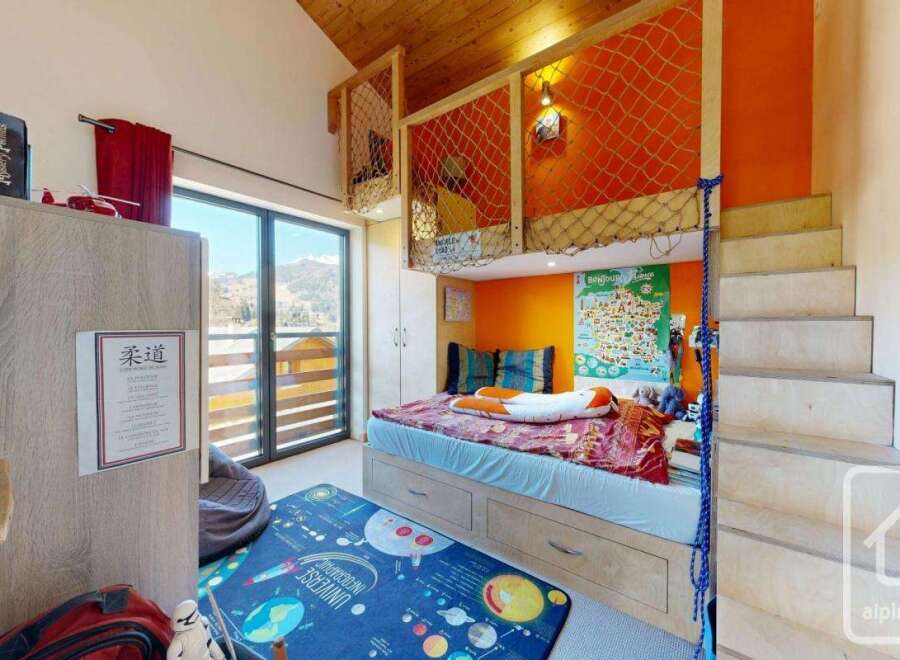 Discover this charming property featuring a unique loft bed design, perfect for a child's room.