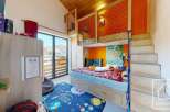 Discover this charming property featuring a unique loft bed design, perfect for a child's room.