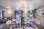 Luxurious chalet with stunning mountain views and a spacious dining area perfect for entertaining guests.