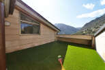 This stunning property boasts a private rooftop terrace with artificial turf, perfect for outdoor relaxation.