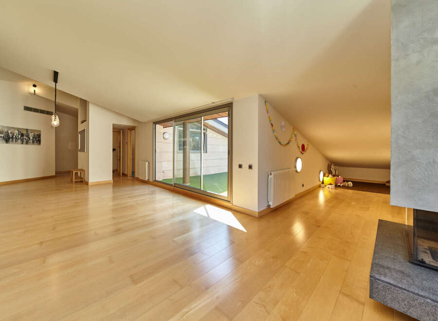 This stunning property boasts a spacious open-plan living area with gleaming hardwood floors and large windows that flood the room with natural light.
