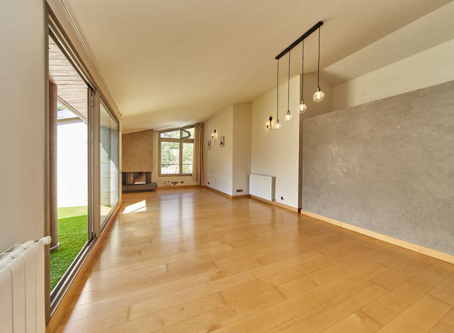 This stunning property boasts a spacious open-plan living area with gleaming hardwood floors and large sliding glass doors that lead to a private garden.