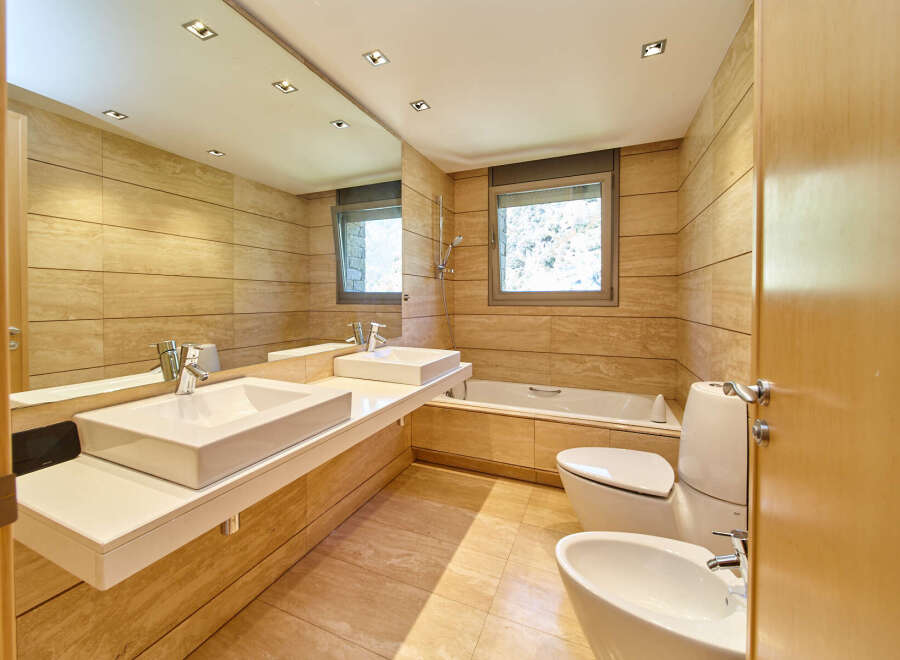 Luxurious bathroom with modern fixtures and finishes.