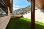This stunning property boasts a private rooftop terrace with artificial turf, perfect for outdoor relaxation.
