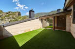 This stunning penthouse boasts a private rooftop terrace with artificial turf, perfect for outdoor relaxation.