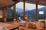 Mountain view living room with a cozy fireplace and comfortable seating.