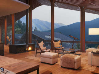 Mountain view living room with a cozy fireplace and comfortable seating.