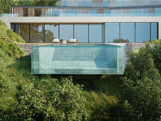 Stunning infinity pool seamlessly blends with the lush hillside, offering breathtaking views.
