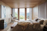 Wake up to breathtaking mountain views from this luxurious bedroom.