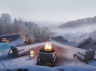 Luxury chalet with breathtaking mountain views and a private rooftop terrace featuring a fire pit, comfortable seating, and an infinity pool.