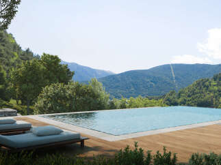Luxury mountain retreat with infinity pool offering breathtaking panoramic views.