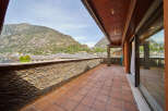 This stunning penthouse boasts a spacious terrace with breathtaking mountain views.