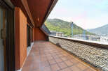 This stunning penthouse boasts a spacious terrace with breathtaking mountain views.