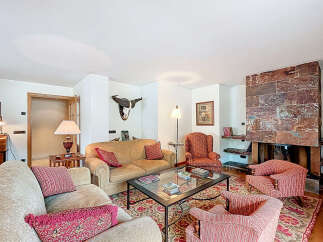This stunning living room boasts a cozy fireplace, perfect for relaxing winter evenings.