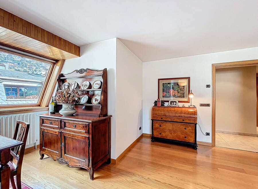 This stunning property boasts a spacious and bright interior with hardwood floors and large windows offering breathtaking views.