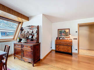 This stunning property boasts a spacious and bright interior with hardwood floors and large windows offering breathtaking views.