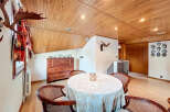 This stunning property boasts a unique dining area with a wooden ceiling and hardwood floors.
