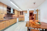 This stunning kitchen boasts beautiful light wood cabinets, granite countertops, and modern appliances.