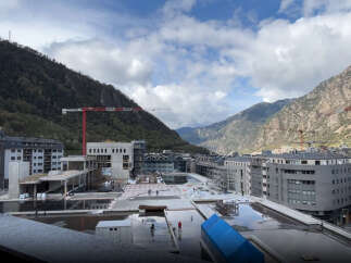 Modern mountainside development with stunning valley views.
