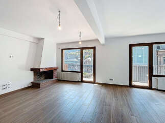 Discover this stunning property featuring a cozy fireplace and elegant wooden floors.