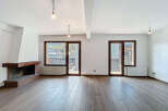 Discover the charm of this stunning property, featuring a spacious living area with beautiful wooden floors.