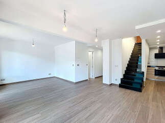 Discover this stunning modern property featuring a bright and airy open-plan living space.