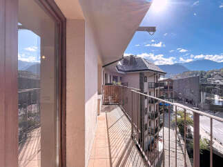 Enjoy breathtaking mountain views from this stunning balcony.