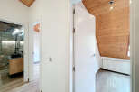 Step into this beautifully designed home featuring a modern bathroom with a sleek black sink and a stylish shower.
