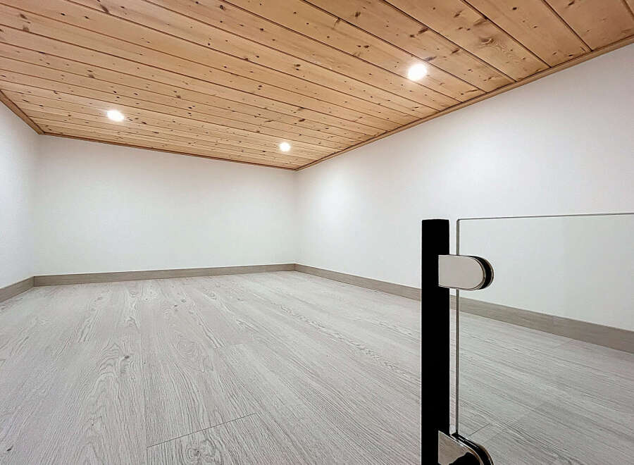 This stunning property boasts a modern interior with a warm and inviting atmosphere.