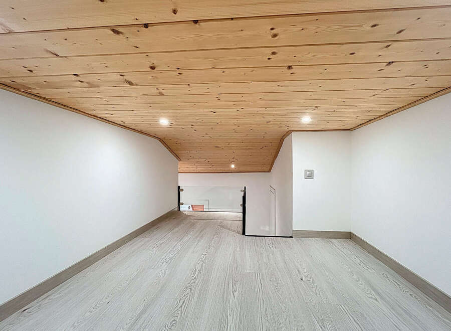 Discover the charm of this beautifully designed space, featuring a stunning wooden ceiling that adds warmth and character.