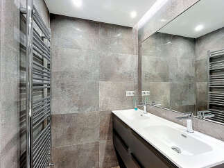 Modern bathroom design featuring a sleek double sink vanity and a large mirror, perfect for a contemporary home.